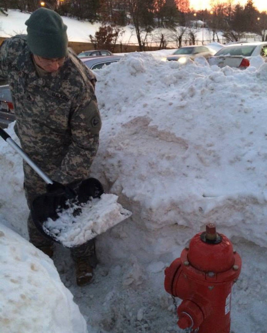 Snow shoveling, such as this shown in Massachusetts last month, was just one way someone in a community helped a National Guard family in a time of need. Community-based family service programs are an important component in a Citizen-Soldier's family.
