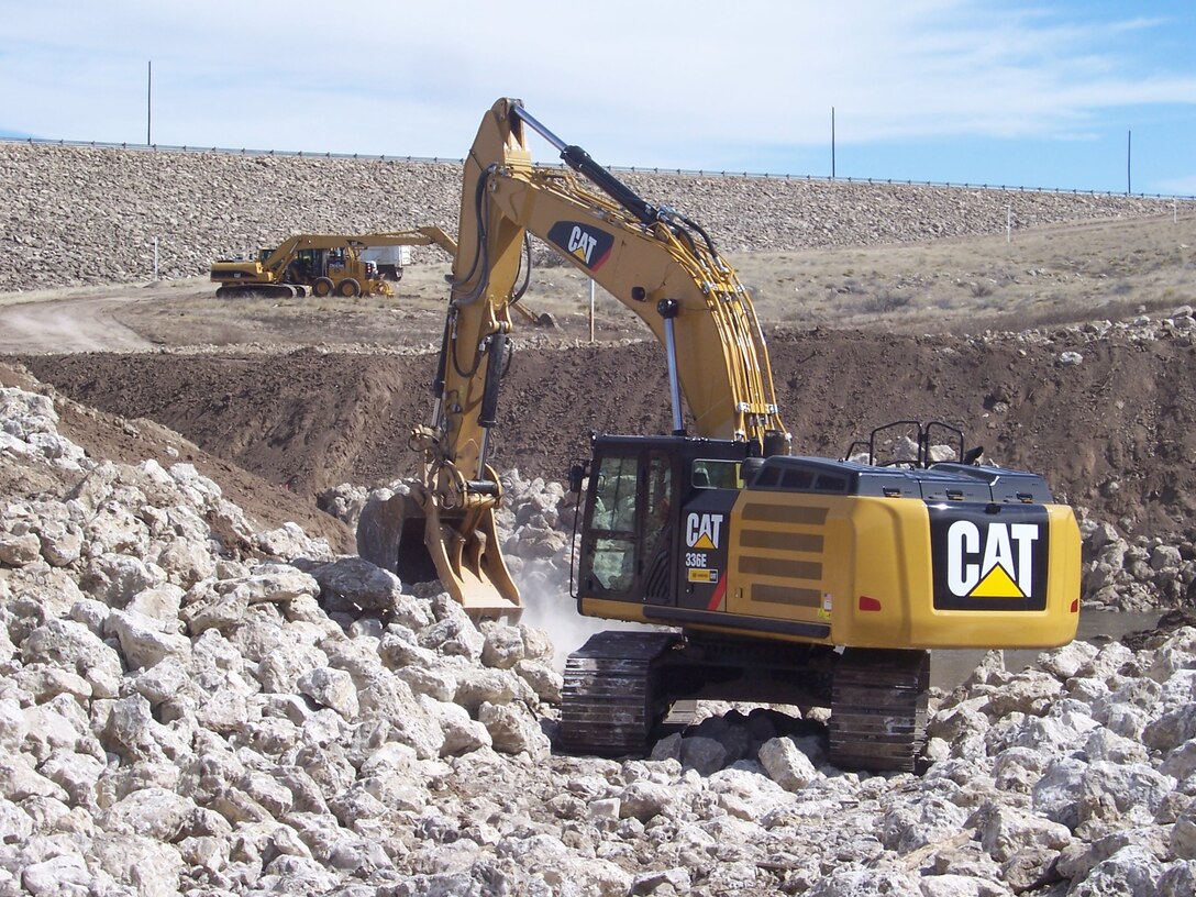 ROSWELL, N.M. – Construction equipment and crew from Reclamation work on a new flood channel at the District’s Two River’s Diamond A Dam, March 8, 2015.