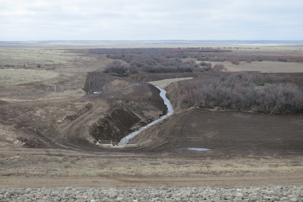 ROSWELL, N.M. – A view of the completed project from the top of Diamond A Dam, March 5, 2015.  The new erosion-control rip rap is seen in the middle of the photo.
