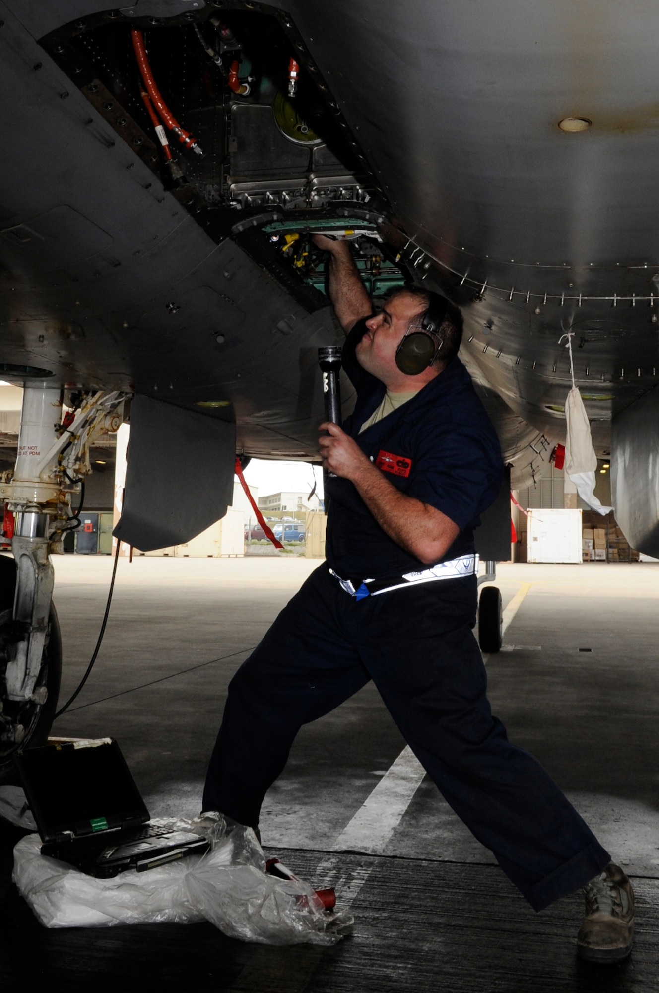 U.S. Air Force Staff Sgt. Adam Kope, 67th Aircraft Maintenance Unit dedicated crew chief, works on an F-15C Eagle’s secondary power during a sortie surge on Kadena Air Base, Japan, March 25, 2015. The 67th AMU worked diligently to keep the aircraft flying, allowing them to complete 278 flying missions in four days, and beating the previous record held by the 44th Fighter Squadron of 244. (U.S. Air Force photo by Staff Sgt. Marcus Morris)