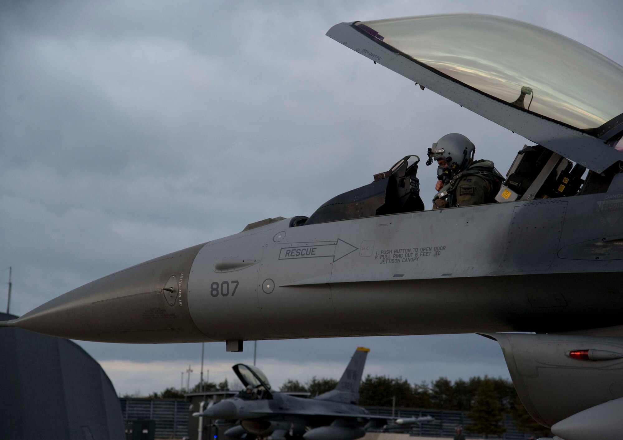 U.S. Air Force Capt. Miklos Preysz, 14th Fighter Squadron pilot, prepares an F-16 Fighting Falcon for a night flight at Misawa Air Base, Japan, Mar. 25, 2015. Pilots conduct regular night flying to remain certified and also prepared to perform in all conditions. (U.S. Air Force photo by Airman 1st Class Jordyn Rucker/Released)