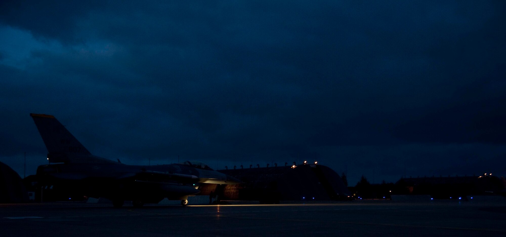 A 14th Fighter Squadron F-16 Fighting Falcon taxis down the runway before a night flight at Misawa Air Base, Japan, Mar. 25, 2015. Night flying is regularly conducted to ensure pilots are prepared to fly in all conditions and environments when called upon. (U.S. Air Force photo by Airman 1st Class Jordyn Rucker/Released)