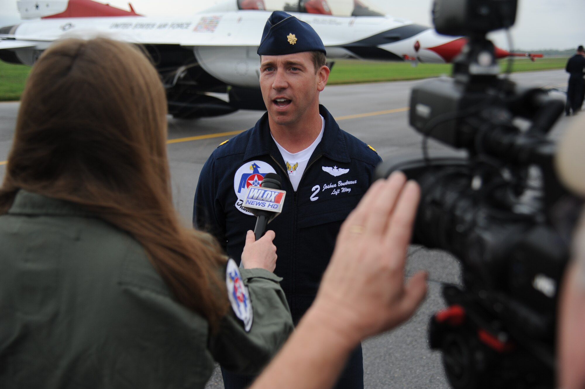Maj. Joshua Boudreaux, U.S. Air Force Thunderbirds left wing number 2, is interviewed by local media in advance of the 2015 Keesler Air Show/Open House March 26, 2015, at Keesler Air Force Base, Miss.  The Thunderbirds are making their first air show appearance at Keesler since 2009.  The event is Keesler’s first air show in 4 years.  (U.S. Air Force photo by Kemberly Groue)