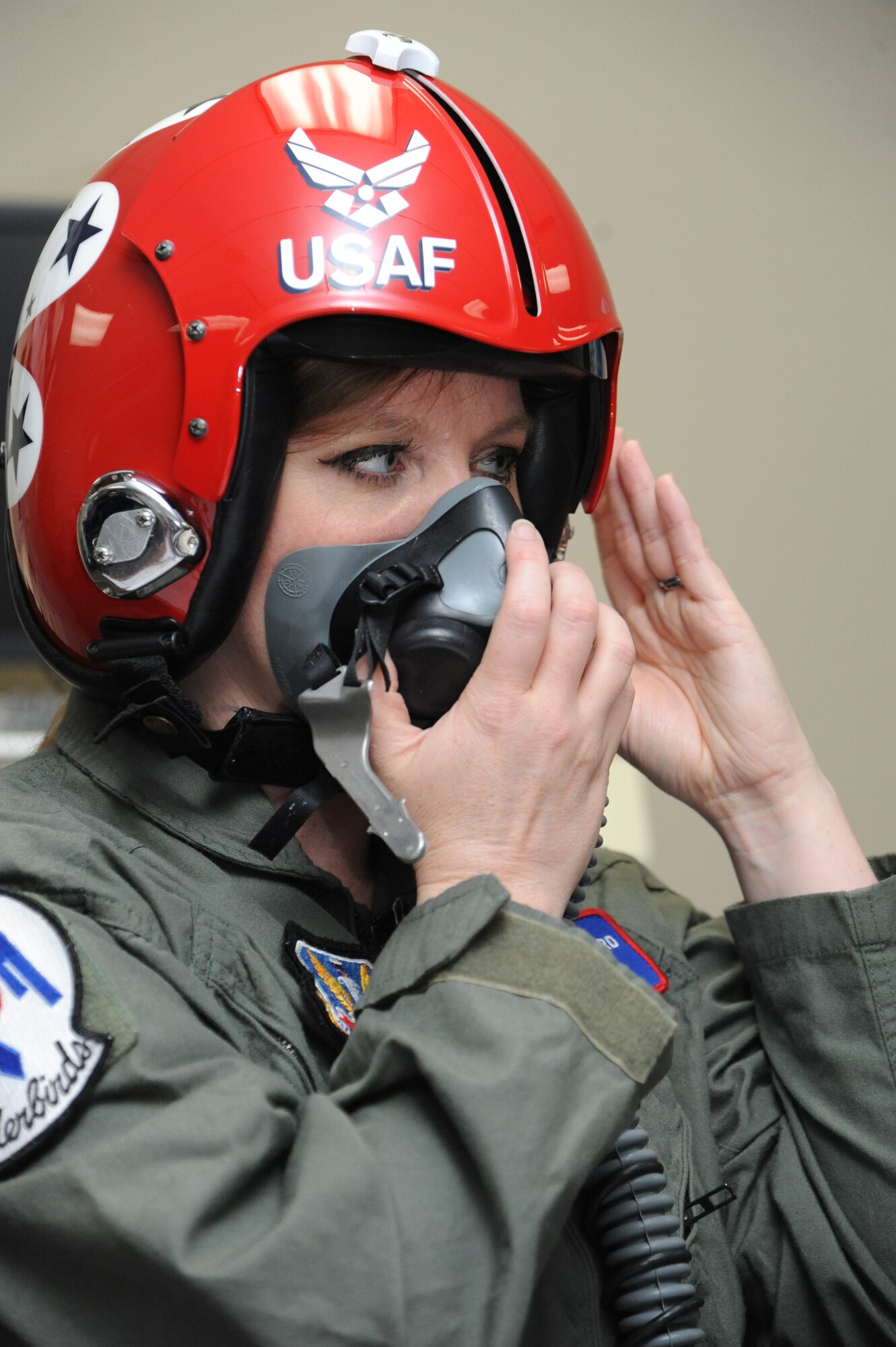 Meggan Gray, WLOX anchor, gets fitted for her flight helmet during flight training March 26, 2015, at Keesler Air Force Base, Miss.  The training was in preparation for a media flight with the U.S. Air Force Thunderbirds March 27.  The Thunderbirds are headlining Keesler’s 2015 Air Show/Open House to be held March 28-29.  (U.S. Air Force photo by Kemberly Groue)