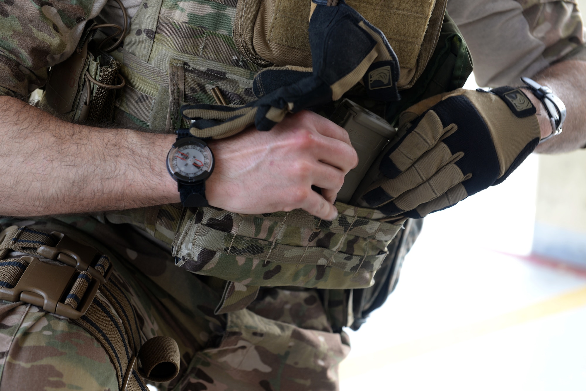 A Tactical Air Control Party Airman from the Washington Air National Guard’s 116th Air Support Operations Squadron fills his pocket with multiple magazines before participating in combat arms training and maintenance for Exercise Husky Machete March 11, 2015, at Andersen Air Force Base, Guam.  The Airmen utilized many of Andersen’s resources, including the firing range for small arms training, facilities at Andersen South, Northwest Field and Tarague Beach for field training. (U.S. Air Force photo by Senior Airman Amanda Morris/Released)