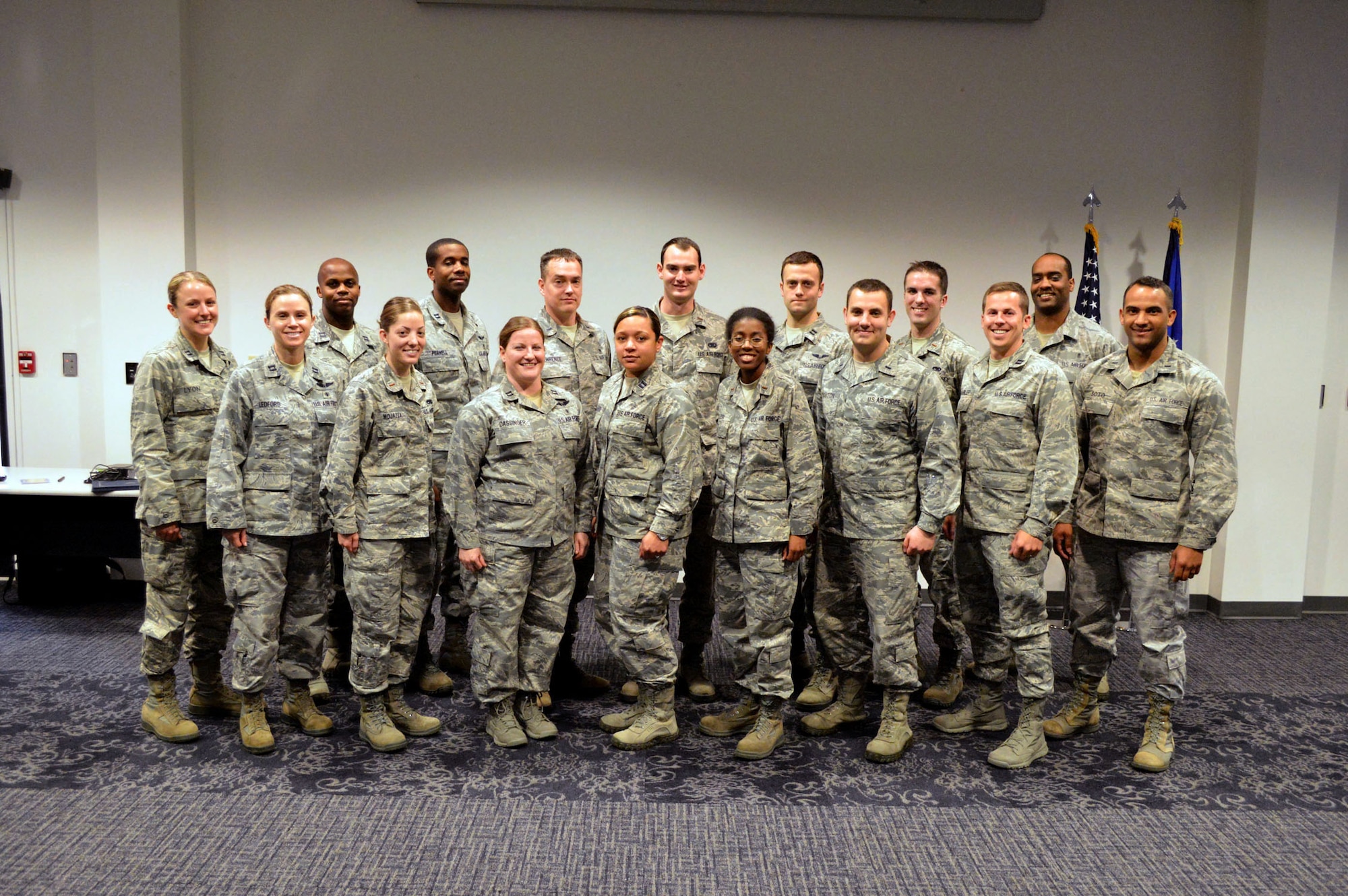 Fifteen Pope company-grade officers pose for a group photo with Master Sgt. Dexter Robinson, 43rd Force Support Squadron career assistance advisor, second row, right, after a three-day professional development seminar Mar. 17-19, held at the Airman’s Center, Pope Army Airfield, N.C. (U.S. Air Force photo/Marvin Krause)