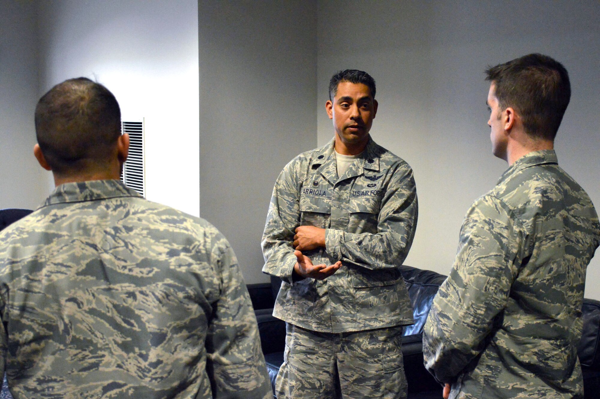 Lt. Col. David Arriola, 682nd Air Support Operations Squadron commander, center, answers a question from 2nd Lt. Anthony King, right, 3rd Aerial Port Squadron, while 1st Lt. Yunior Soto, 43rd Logistics Readiness Squadron, left, listens, during a company-grade officer professional development seminar Mar. 19 at the Airman’s Center, Pope Army Airfield, N.C. (U.S. Air Force photo/Marvin Krause)
