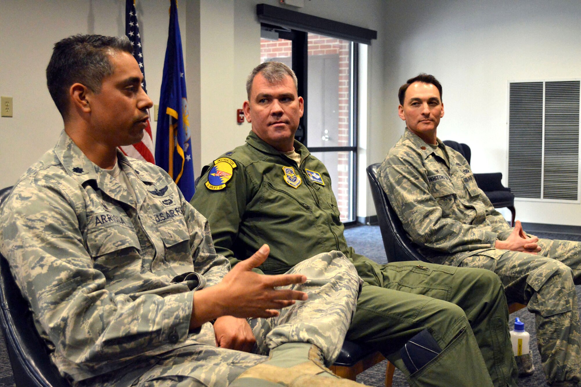 Lt. Col. David Arriola, 682nd Air Support Operations Squadron commander, left, answers a question during a company-grade officer professional development seminar commanders’ panel Mar. 19 at the Airman’s Center, Pope Army Airfield, N.C. while Lt. Col. Patrick O’Sullivan, 2nd Airlift Squadron commander, middle, and Maj. Joseph Whittington, 3rd Aerial Port Squadron commander, right, listen. (U.S. Air Force photo/Marvin Krause)