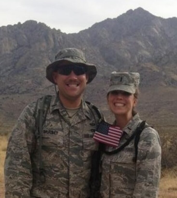 Capt. Holly Bradley and her husband at the final mile marker of the Bataan Memorial Death March in 2014. Bradley works for the Air Force Research Laboratory investigating the suitability of modern electronics for the radiation found in space.  (Courtesy photo)