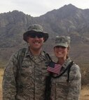 Capt. Holly Bradley and her husband at the final mile marker of the Bataan Memorial Death March in 2014. Bradley works for the Air Force Research Laboratory investigating the suitability of modern electronics for the radiation found in space.  (Courtesy photo)