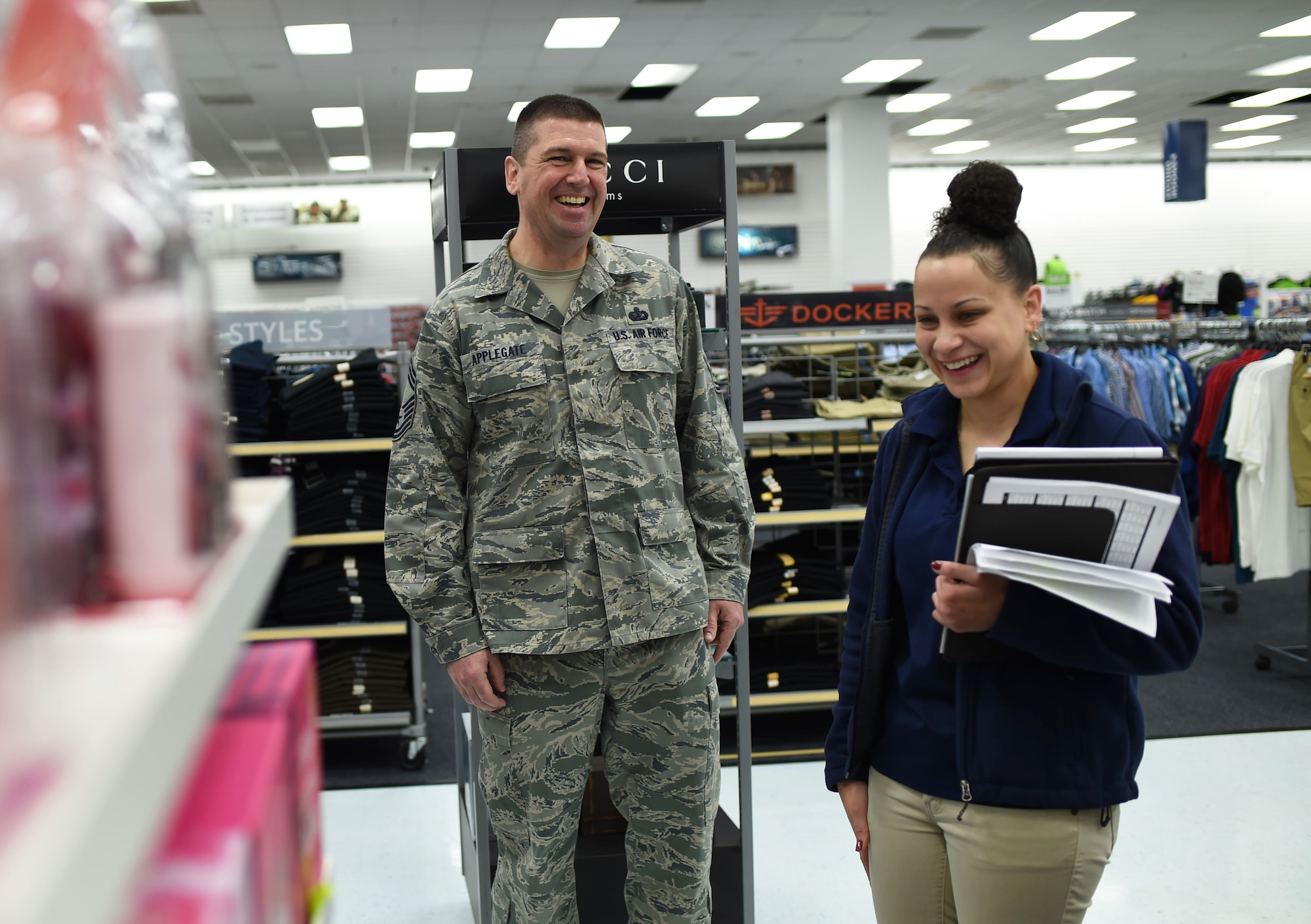 U.S. Air Force Chief Master Sgt. Sean Applegate, Army and Air Force Exchange Service senior enlisted advisor, laughs with an exchange employee March 26, 2015, on Buckley Air Force Base, Colo.  The senior leader spoke with the exchange employees on how the exchange can better serve the community. (U.S. Air Force photo by Airman 1st Class Samantha Saulsbury/Released)
