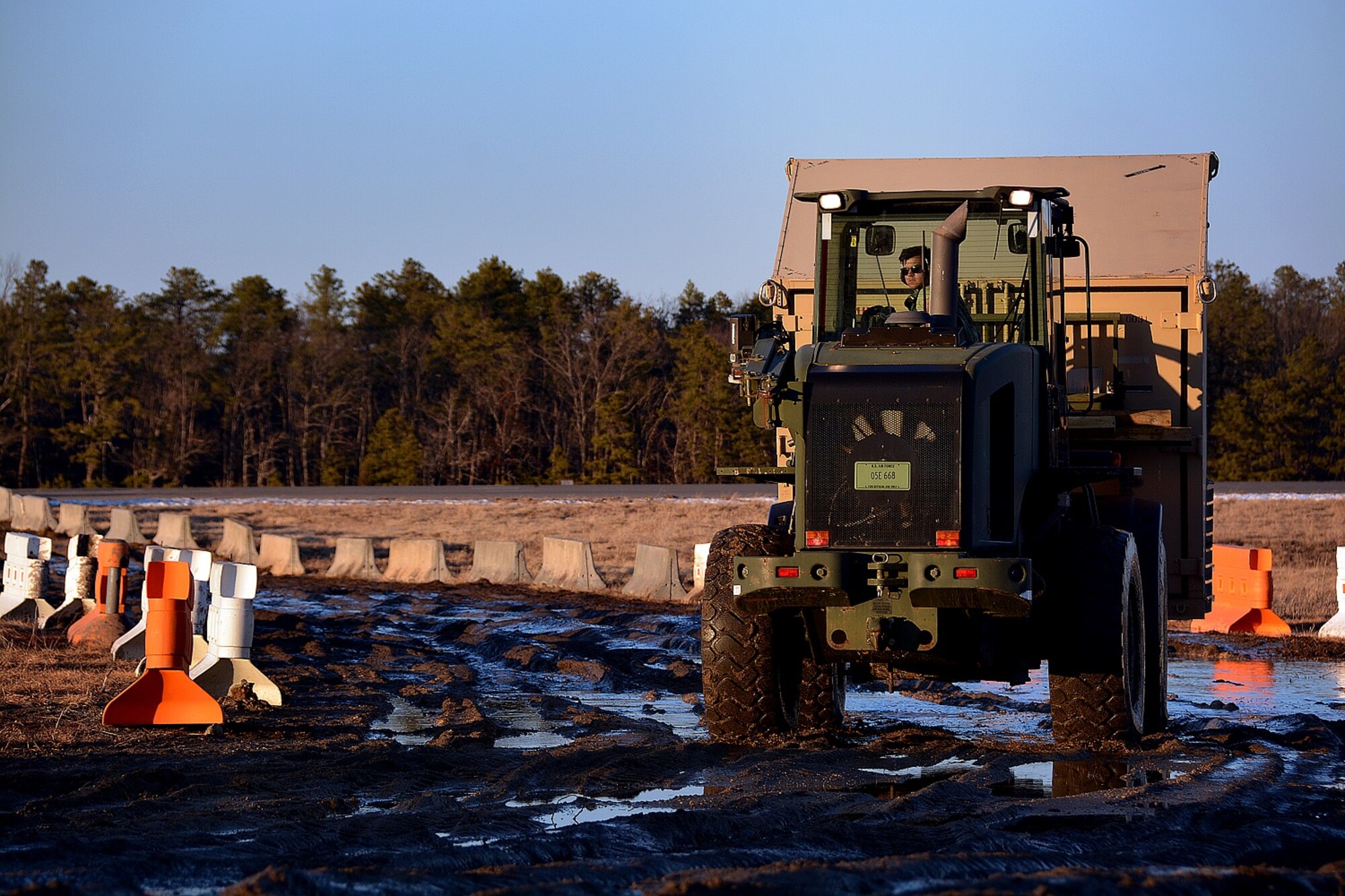 Airman 1st Class Mason McAnear, 570th Global Mobility Squadron, transports cargo supplies, March 9, 2015, during Exercise EAGLE FLAG 15-2, at Joint Base McGuire-Dix-Lakehurst, New Jersey. The goal of EF is to provide U.S. forces with an environment to exercise the knowledge and skills required for any type of forward operation, in any environment, regardless of mission or aircraft type. (U.S. Air Force photo by Senior Airman Charles Rivezzo) 