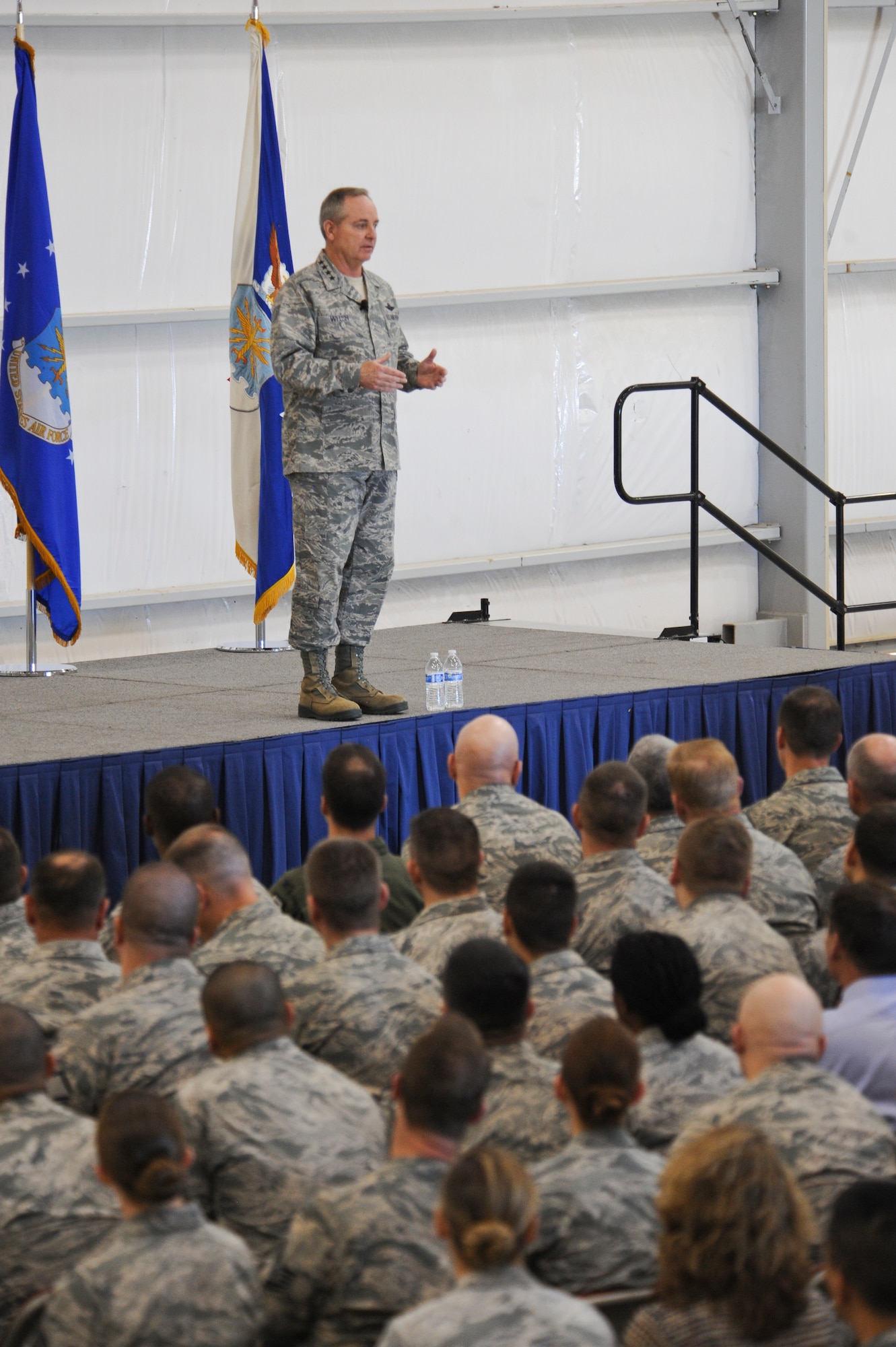 Air Force Chief of Staff Gen. Mark A. Welsh III addresses the Desert Lightning Team during an all-call at Davis-Monthan Air Force Base, Ariz., March 25, 2015. During his visit to D-M, Welsh received a mission brief, spoke with Airmen from the 354th Fighter Squadron about the future of the Air Force, attended a lunch with 12 Air Force (Air Forces Southern), 355th Fighter Wing, and additional tenant unit commanders and Airmen, held an all-call, and took a tour of the AMARG. (U.S. Air Force photo by Cheyenne Morigeau/released)
