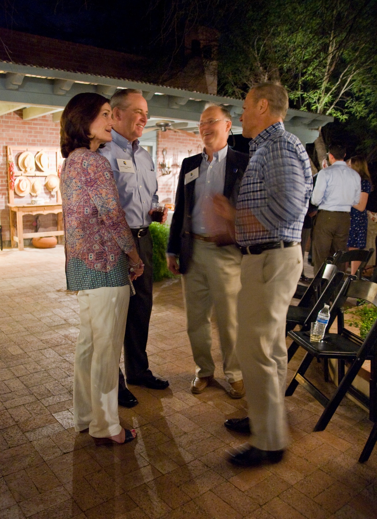 Air Force Chief of Staff Gen. Mark A. Welsh III and his wife, Betty, speak to
Dr. Bryan Foulk, DM50 member and Lt. Gen. Mark Nowland, 12th Air Force (Air
Forces Southern) commander, during a social gathering in Tucson, Ariz., March
24, 2015. The DM50 and civic leaders attended the event to welcome the
Welsh's.  (U.S. Air Force photo by Staff Sgt. Angela Ruiz/released)
