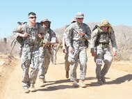Participants in the annual Bataan Memorial Death March make their way to the finish line. The event is staged each year to honor the thousands of American and Filipino service members who were captured by Japanese forces in April 1942 and forced to march 65 miles with no food or water. (Courtesy photo)