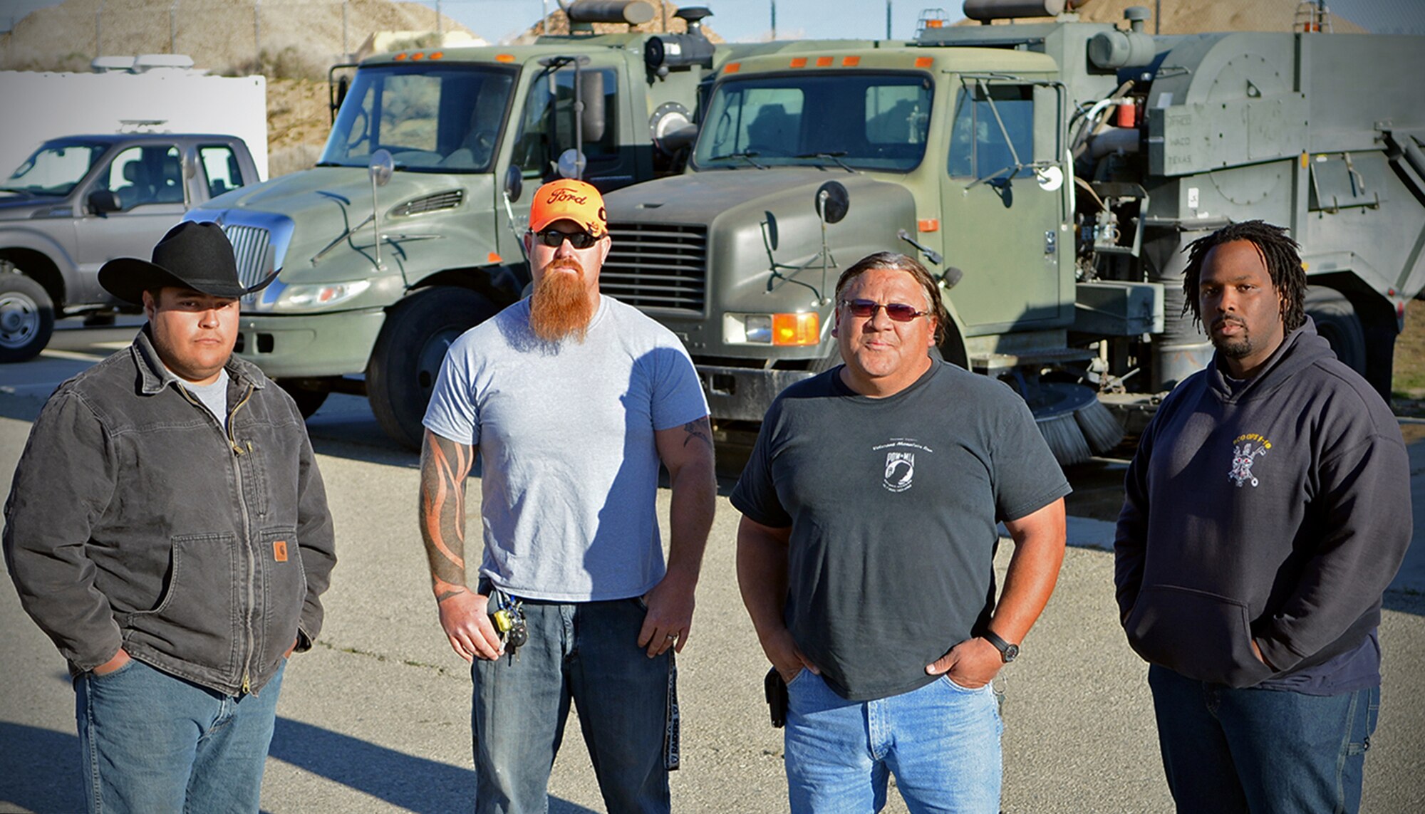 (From left to right) Moses Zamora, Neil Edwards, Robin "Bubba" Hairston, and Derrick Shannon are heavy equipment operators with the 412th Civil Engineer Group who saved the life of their coworker who collapsed in his flightline sweeper March 13 by administering CPR and calling emergency medical services. (U.S. Air Force photo by Jet Fabara)