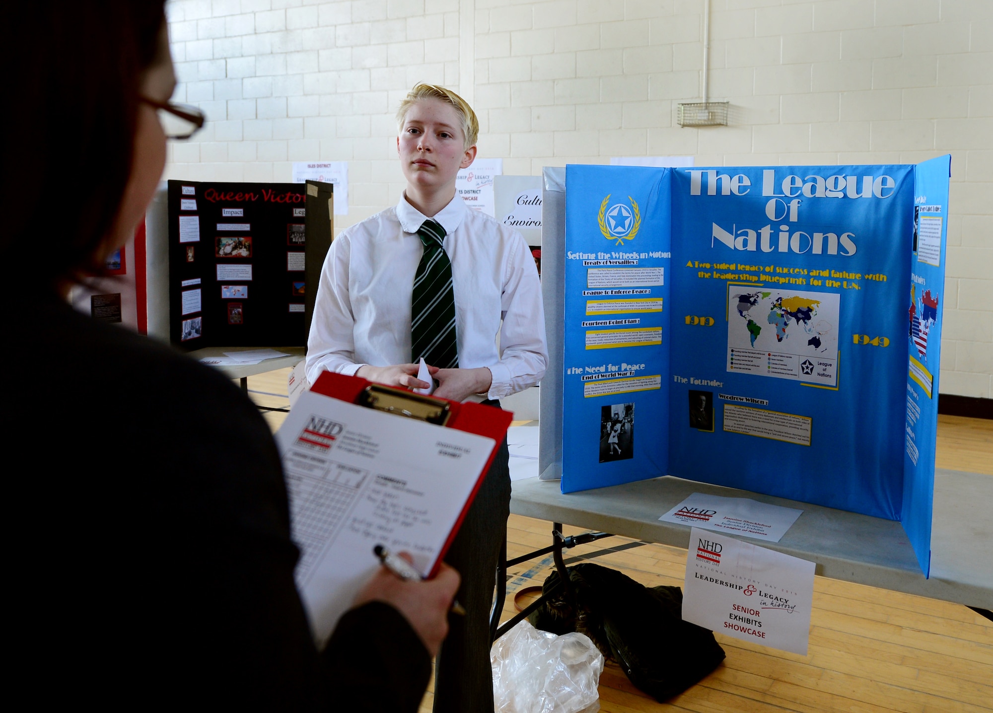 Jasmine Shackleford, Royal Air Force Alconbury High School student, presents her project to judges during the National History Day competition at RAF Lakenheath High School, England, March 25, 2015. More than 125 students from local Department of Defense Dependent Schools participated in the showcase. This year’s theme was “Leadership and Legacy in History.” (Air Force photo by Airman 1st Class Dawn M. Weber/Released)