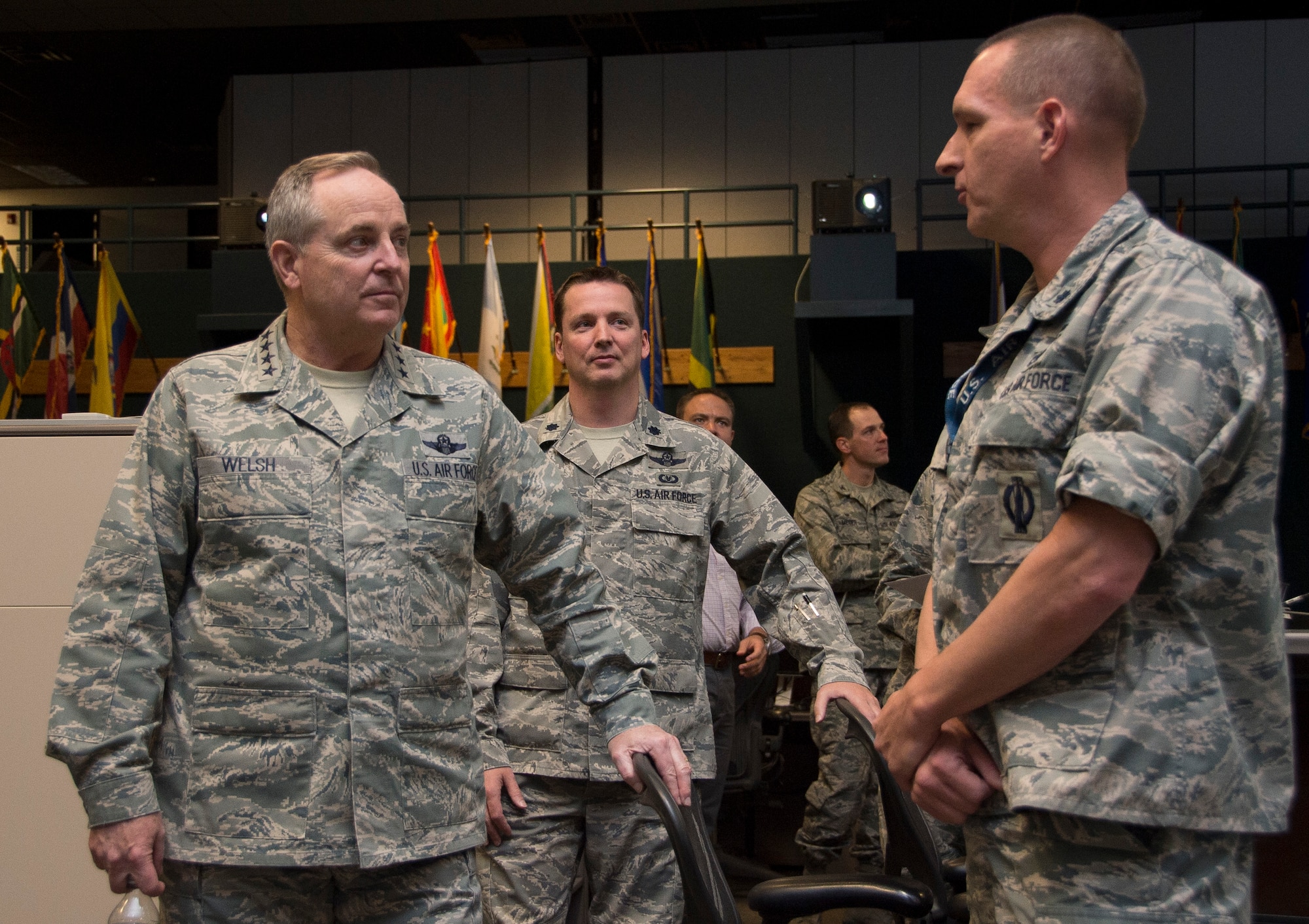 Air Force Chief of Staff Gen. Mark A. Welsh III, receives a brief from Lt. Col John Ferko, Air Forces Southern chief of special tactical operations, during a visit to the 612th Air Operations Center on March 25, 2015 at Davis-Monthan AFB, Ariz. During the visit, Welsh engaged with both leadership and Airmen during a base-wide all call. (U.S. Air Force photo by Staff Sgt. Adam Grant/Released)