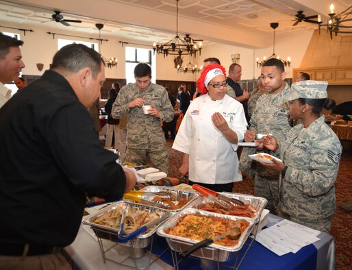 Staff from the 100th Force Support Squadron Gateway Dining Facility sample dishes served at a customer appreciation event March 25, 2015, on RAF Mildenhall, England. Vendors from the United States, United Kingdom and Germany showcased their new food items to customers, offering samples which Airmen and civilians gave feedback on, saying whether or not they would like the products to be available at the dining facility. (U.S. Air Force photo by Karen Abeyasekere/Released)