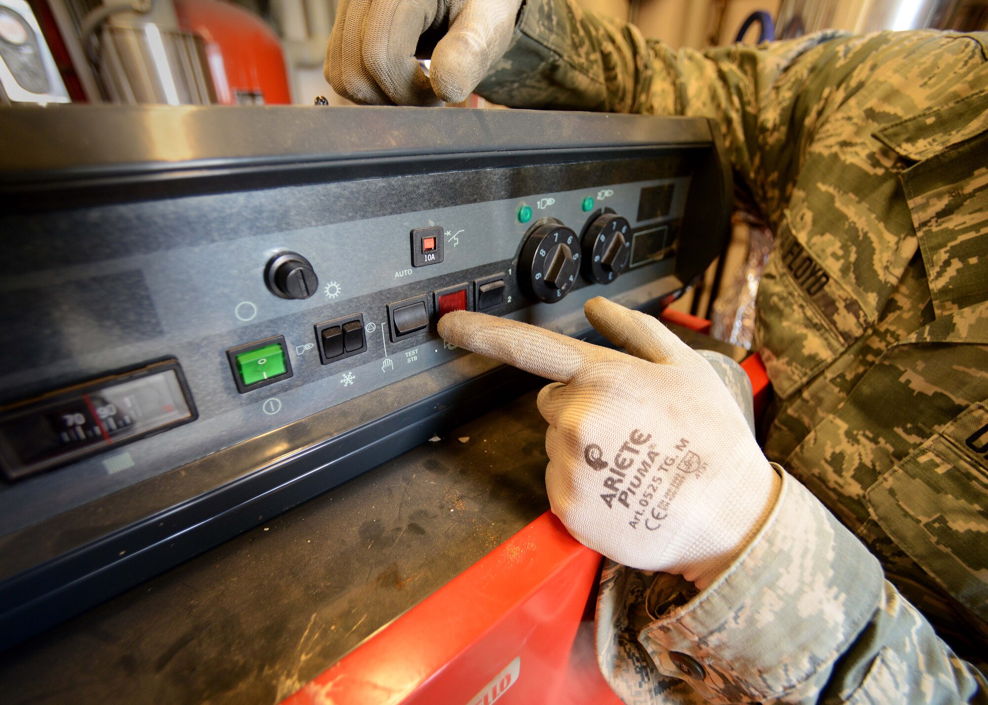 U.S. Air Force Airman 1st Class Jedadiah Floyd, 31st Civil Engineer Squadron heating, ventilation, air conditioning and refrigeration technician, shuts off a boiler in the dormitories, March 24, 2015, at Aviano Air Base, Italy. When the heating system is turned off during the “no heat, no cool” season, this energy conservation program saves the base more than $320,000 a month. (U.S. Air Force photo by Airman 1st Class Deana Heitzman/Released)