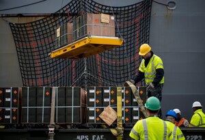 Sailors and Marines with the Navy Munitions Command Unit Charleston offload cargo from the USNS Lewis and Clark (T-AKE-1) March, 25, 2015, at Naval Weapons Station Wharf Alpha, Charleston, S.C. The Lewis and Clark is a replenishment naval vessel. In 2012, USNS Lewis and Clark became one of 14 ships that comprise the United States Marine Corps Maritime Prepositioning Program. Prepositioning ships provide quick and efficient movement of military equipment/supplies between operating areas without reliance on other nations' transportation networks. These ships give U.S. regional combatant commanders the assurance that they will have what they need to quickly respond in a crisis - anywhere, anytime. (U.S. Air Force photo/Airman 1st Class Clayton Cupit)