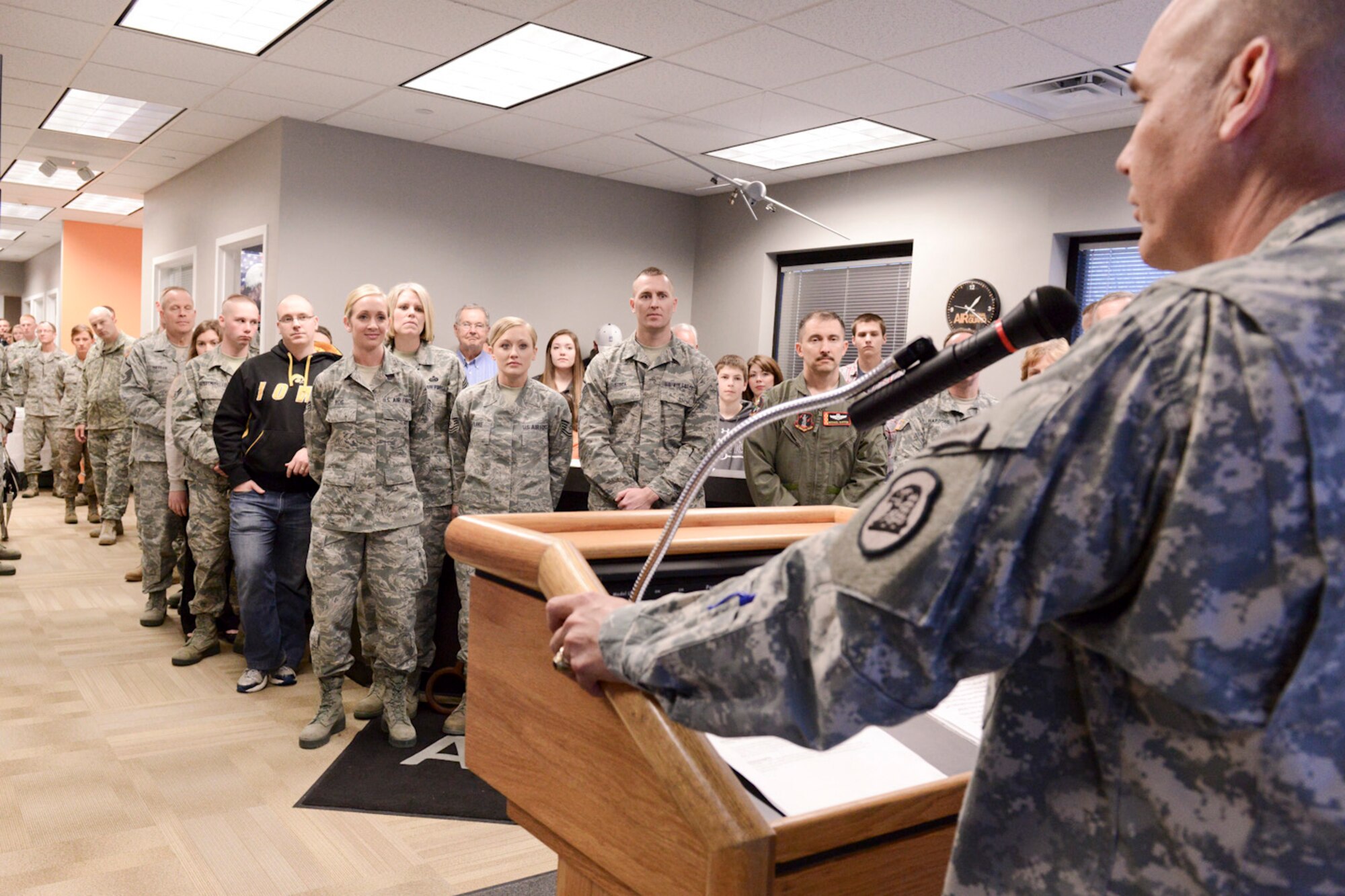 The Adjutant General of the Iowa National Guard, Maj. Gen. Timothy Orr (podium), speaks to members of the Iowa Air and Army National Guard as they celebrate the opening of the 132d Wing, Des Moines, Iowa off-site Recruiting Operation Center during a ribbon cutting ceremony held at the new Recruiting Operation Center in West Des Moines, Iowa on Tuesday, March 24, 2015.  (U.S. Air National Guard photo by Staff Sgt. Linda K. Burger/Released)