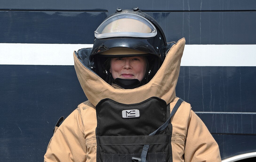Tech. Sgt. Molly Callen, 8th Civil Engineer Squadron explosive ordnance disposal team lead, dons the Med-Eng EOD-9 bomb suit March 20, 2015 at Kunsan Air Base, Republic of Korea. As an EOD technician, Callen is trained to deactivate improvised explosive devices and to inspect unexploded ordnances. (U.S. Air Force photo by Senior Airman Divine Cox/Released)