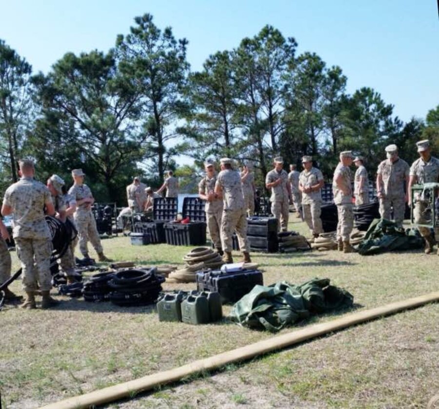 Marines from BWST 4-15 conduct practical application on set up and operation of the Light Weight Water Purification System.