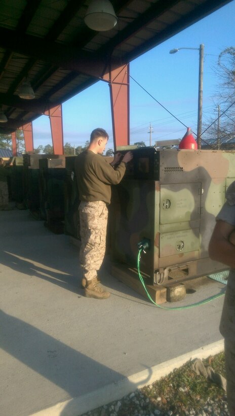 Marines from BEEEST 5-15 conduct practical application on generator troubleshooting.