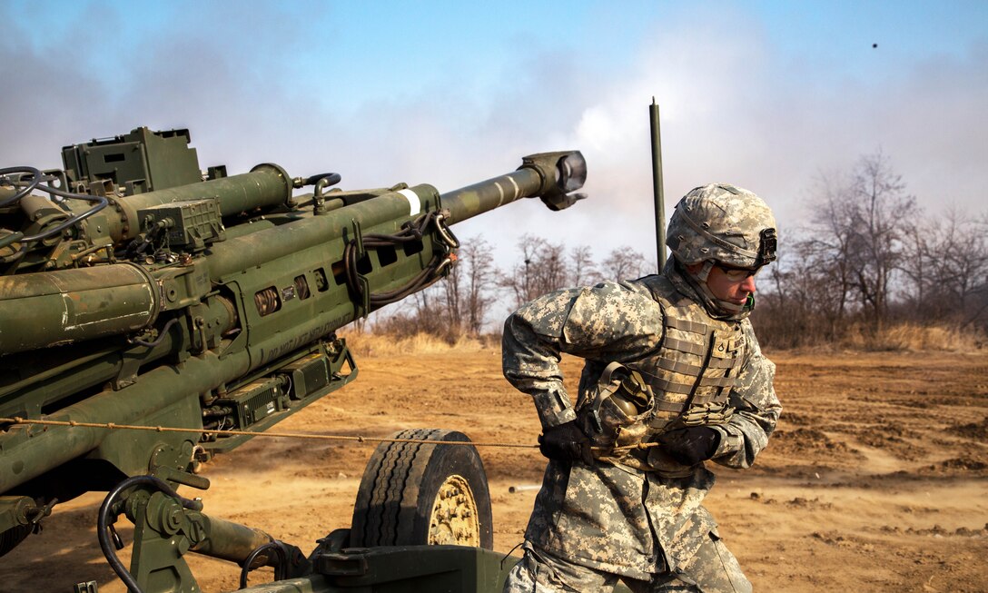 U.S. Army Pfc. Morros fires an M777A2 howitzer during field artillery training, part of exercise Foal Eagle 2015 on Warrior Base, New Mexico Range, South Korea, March 15, 2015. Morros is assigned to the 25th Infantry Division's 2nd Battalion, 11th Field Artillery Regiment, 2nd Stryker Brigade Combat Team.