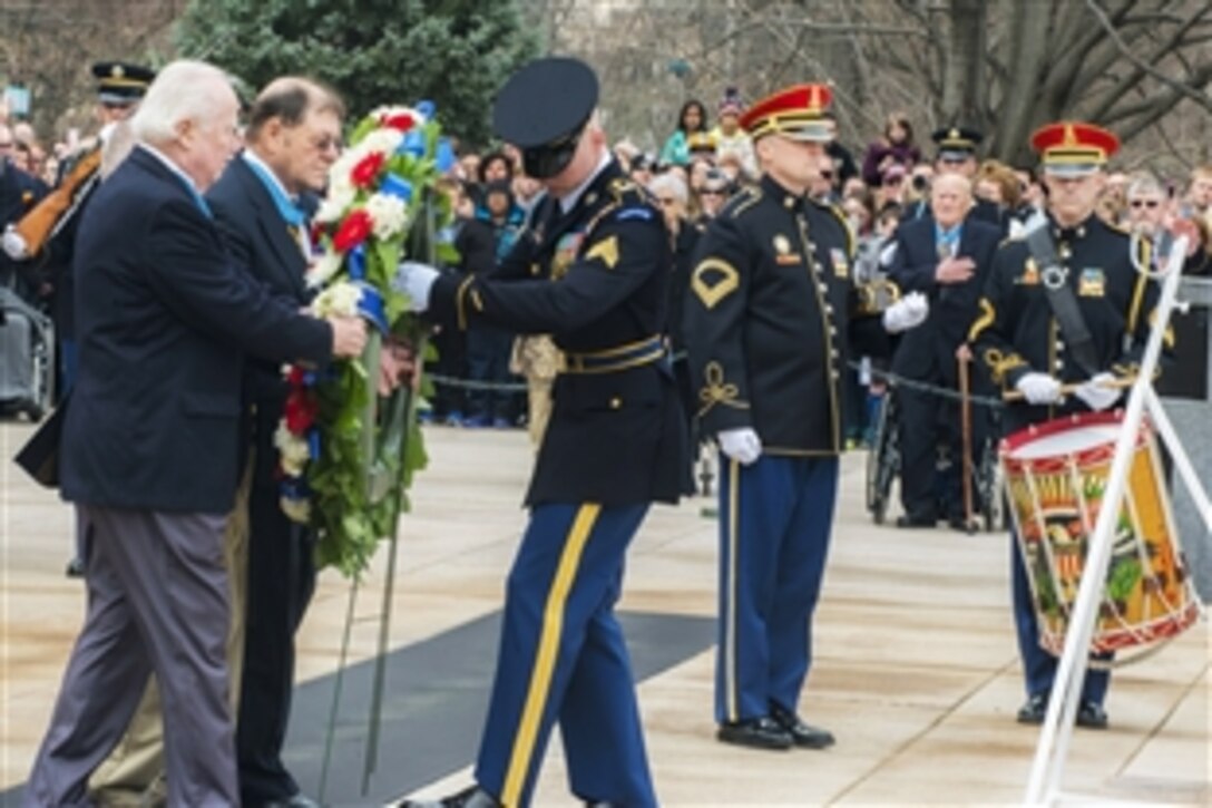 Participants in a National Medal of Honor Day ceremony place a wreath at the Tomb of the Unknown Soldier at Arlington National Cemetery in Arlington, Va., March 25, 2015. Nearly 30 recipients of the Medal of Honor, the nation’s highest military decoration, attended the event.