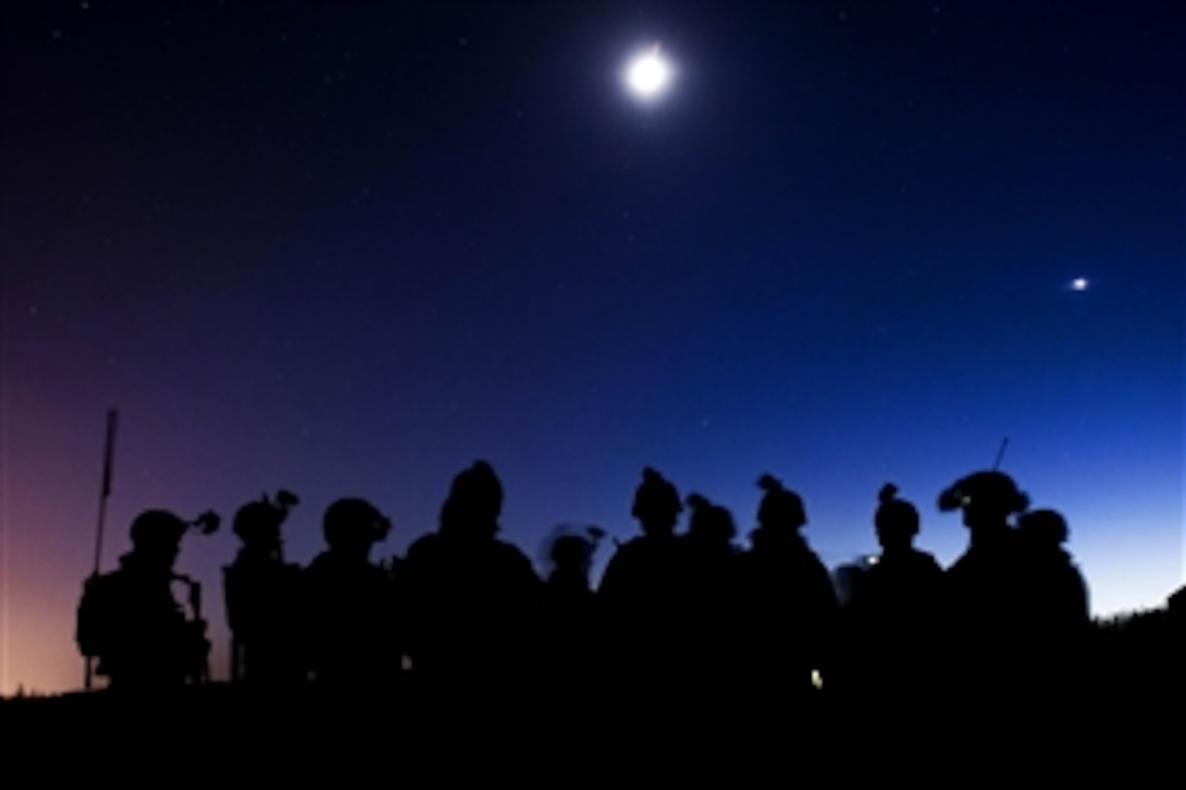 Soldiers conduct an after action review following  a night live-fire exercise on Neibar drop zone on Joint Base Elmendorf-Richardson, Alaska, March 23, 2015. The soldiers are paratroopers assigned to the 25th Infantry Division's 3rd Battalion, 509th Infantry Regiment, 4th Infantry Brigade Combat Team.