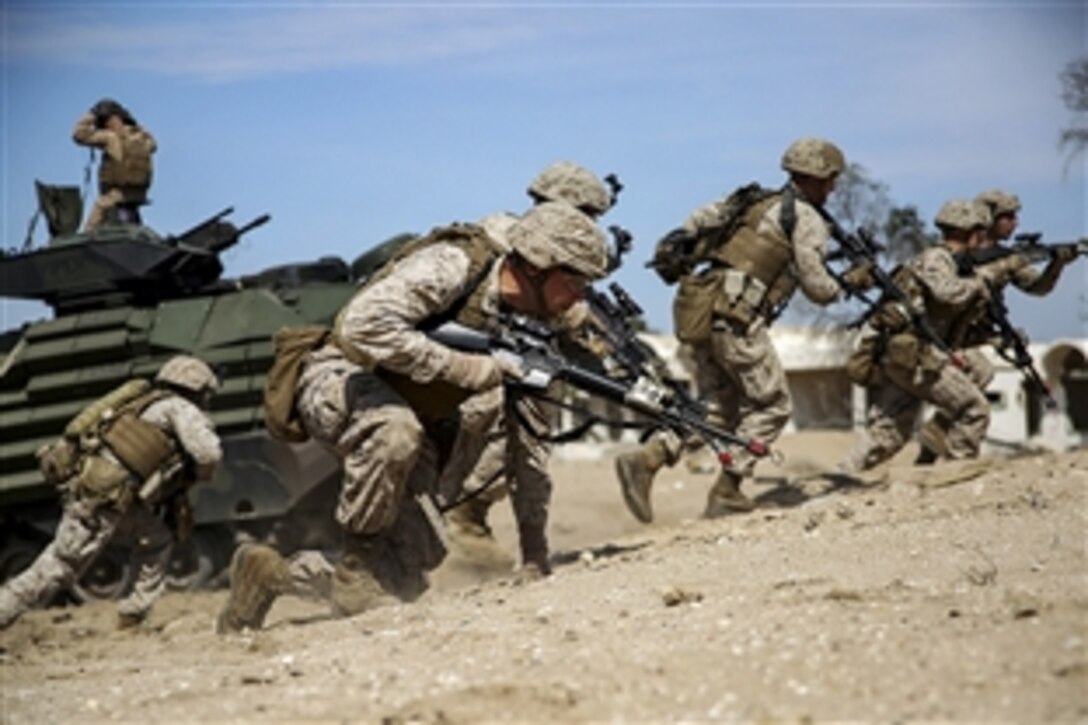 U.S. Marines assault a simulated objective during Exercise Eagle Resolve 2015 on Failaka Island, Kuwait, March 24, 2015. 