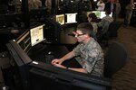 A Virginia National Guard Airman from the 192nd Intelligence Squadron demonstrates some of the intelligence, surveillance and reconnaissance capabilities they use to support operations across the globe March 17, 2015, at Langley AFB.