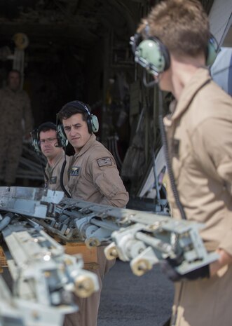 Cpl. Eli Wallace, Sgt. David Dougal and Lance Cpl. Kasey Pike, crew masters with Marine Aerial Refueler Support Squadron 152, load equipment onto a Lockheed KC-130J Hercules aircraft in USAG Daegu Army Base, South Korea, March 24, 2015. Within the Marine Corps, the C-130 is the only aerial refueling platform and it’s the only aircraft capable of completing large scale transport and aerial delivery missions.