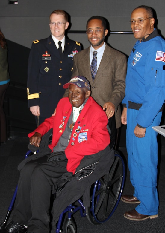 Brig. Gen. David Hill, SWD commander, joins NASA astronaut Col. Benjamin A. Drew and Tuskegee Airman Lt. Calvin Spann along with SWD engineer Dr. Michael Sterling (center) at the Perot Museum in Dallas for National Engineers Week activities.