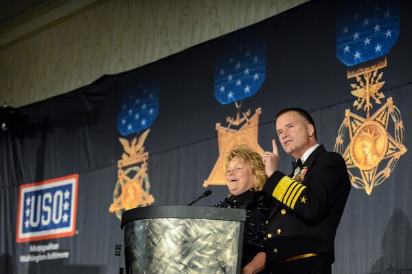 Vice Chairman of the Joint Chiefs of Staff Adm. James A. Winnefeld Jr. and his wife, Mary, speak before an audience of approximately 600 during the USO of Metropolitan Washington-Baltimore’s 33rd Annual Awards Dinner in Washington D.C., March 24, 2015. The Winnefeld’s presented Peyton Manning, NFL quarterback for the Denver Broncos, a USO Metro Merit Award for his support of the military through his USO tours and visits with wounded, ill and injured service members.