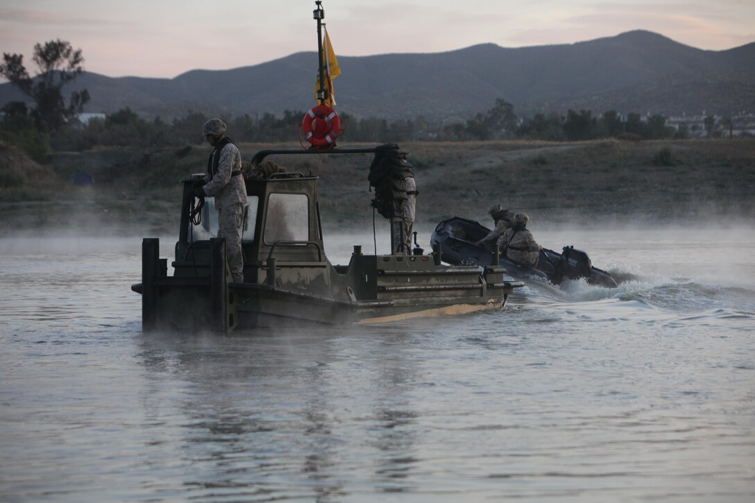 Marines from Bridge Company, 7th Engineer Support Battalion, 1st Marine Logistics Group, conduct a bridge exercise at Lake Elsinore, Calif., March 24, 2015. Marines built an improved ribbon bridge and a medium girder bridge. This event marks the first time a continuous span bridge from shore to shore has been built since 2002.
