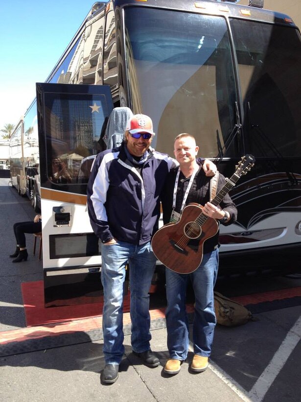 Lt. Col. Mike Corrado, Deputy Assistant Chief of Staff G-3, 4th Marine Division   stands back stage with singer/song writer Toby Keith during ACM Presents: An All-Star Salute To The Troops at the MGM Grand Garden Arena on April 7, 2014 in Las Vegas, Nevada.
