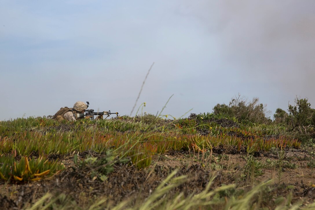 A U.S. Marine with Lima Company, Battalion Landing Team 3rd Battalion, 1st Marine Regiment, 15th Marine Expeditionary Unit, provides security during a raid on San Clemente Island, Calif., March 22, 2015. This raid was part of Composite Training Unit Exercise (COMPTUEX), preparing the Marines and Sailors of the Essex Amphibious Ready Group and 15th MEU for their deployment. (U.S. Marine Corps photo by Cpl. Anna Albrecht/Released)
