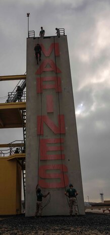 A recruit of Delta Company, 1st Recruit Training Battalion, fast ropes down the 60-foot tower at Marine Corps Recruit Depot San Diego, March 20. Marines with static rope suspension training monitored the exercise from the top and bottom of the tower.