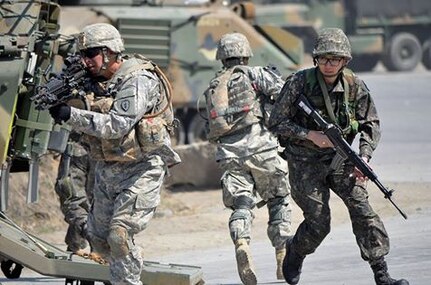 POCHEON, South Korea (Mar. 25, 2015) - U.S. and Republic of Korea Soldiers dismount from a Stryker Armored Fighting Vehicle and prepare to pull security at the Multi-purpose Range Complex near Pocheon during a Combined Capabilities Exercise as part of the annual defensive field-training exercise Foal Eagle. 