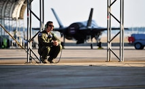 Capt. Jeffrey Osborne, 58th Fighter Squadron F-35 pilot and chief of standardization and evaluation, provides support to Royal Australian Air Force Squadron Leader Andrew Jackson's, F-35 Lightning II student pilot, as he prepares to take his first flight in an F-35A on Eglin Air Force Base, Florida, March 18, 2015. Jackson arrived in the United States in December 2014 and started his training at the F-35 Academic Training Center on Jan. 26, Australia Day. Since then, Jackson has completed 154 classroom hours and 64 hours throughout 16 flight simulations, before stepping to his first aircraft. (U.S. Air Force photo by Staff Sgt. Marleah Robertson)