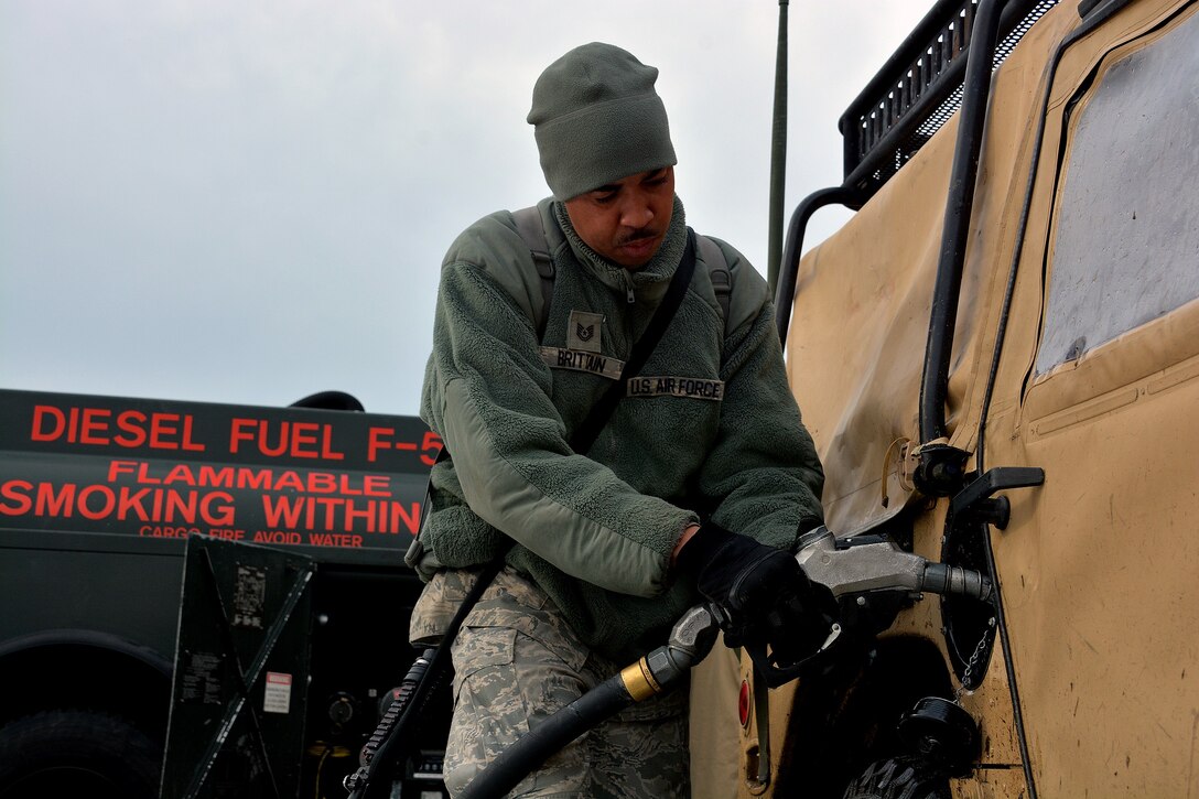 Tech. Sgt. Horace Brittain, 570th Global Mobility Readiness Squadron, refuels a H, March 11, 2015, during Exercise Eagle flag 15-2, at Joint Base McGuire-Dix-Lakehurst, New Jersey. Exercise Eagle Flag is designed for developing, testing and rehearsing the expeditionary combat support library of capabilities. (U.S. Air Force photo/Senior Airman Charles Rivezzo)