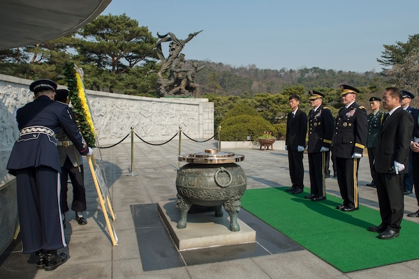 18th Chairman of the Joint Chiefs of Staff Gen. Martin E. Dempsey (right center) and Commander of U.S. Forces Korea Gen. Curtis M. Scaparrotti (left center) lays a wreath at the ROK National Cemetery in Seoul, March 27, 2015. Dempsey is visiting Seoul as part of a two-day trip to reinforce the U.S.-ROK Alliance. 
