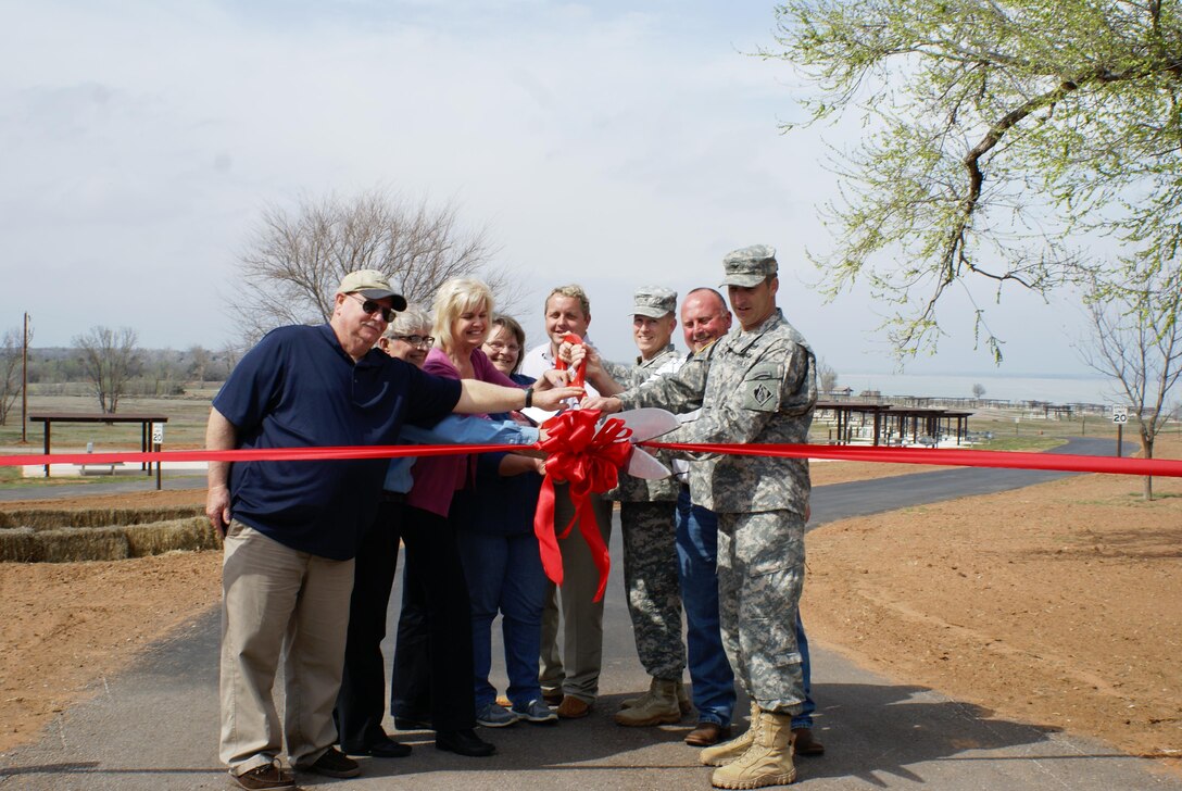 Brig. Gen. David C. Hill, Southwestern Division Commander, Col. Richard A. Pratt, Tulsa District Commander are joined by members of the Canton community as they cut the ribbon to Canadian Campground "A" at Canton Lake, March 25.