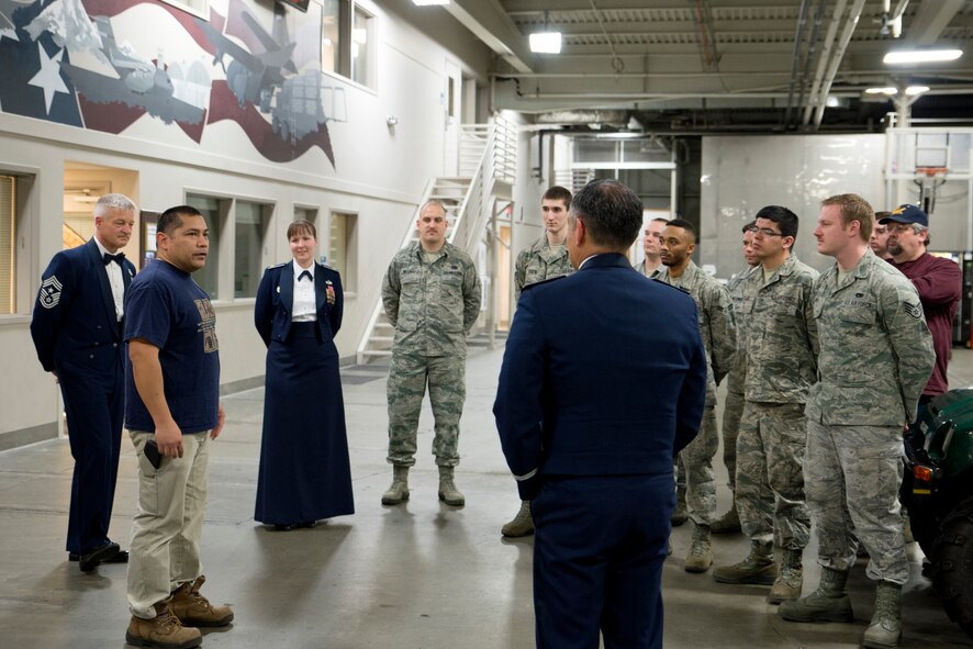 James San Agustin (left), 62nd Aerial Port Squadron aircraft freight loader and weapons safety officer, gives a few words March 26, 2015, about his selection as the Air Mobility Command’s Civilian of the Year Category I at Joint Base Lewis-McChord, Wash. San Agustin operates and trains personnel on 37 vehicles valued in more than $21 million. (U.S. Air Force photo/Airman 1st Class Keoni Chavarria)