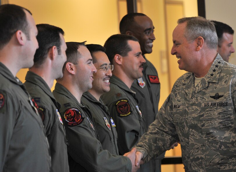 Chief of Staff of the Air Force Gen. Mark A. Welsh III, right, meets with 432nd Wing/432nd Air Expeditionary Wing pilots before a roundtable sit-down during his visit to Creech Air Force Base, Nevada, March 24, 2015.  During his discussion, Welsh, highlighted the changes within the Air Force such as the new enlisted performance report system, force management, and the importance of the ISR mission. (U.S. Air Force photo by Airman 1st Class Christian Clausen/Released)