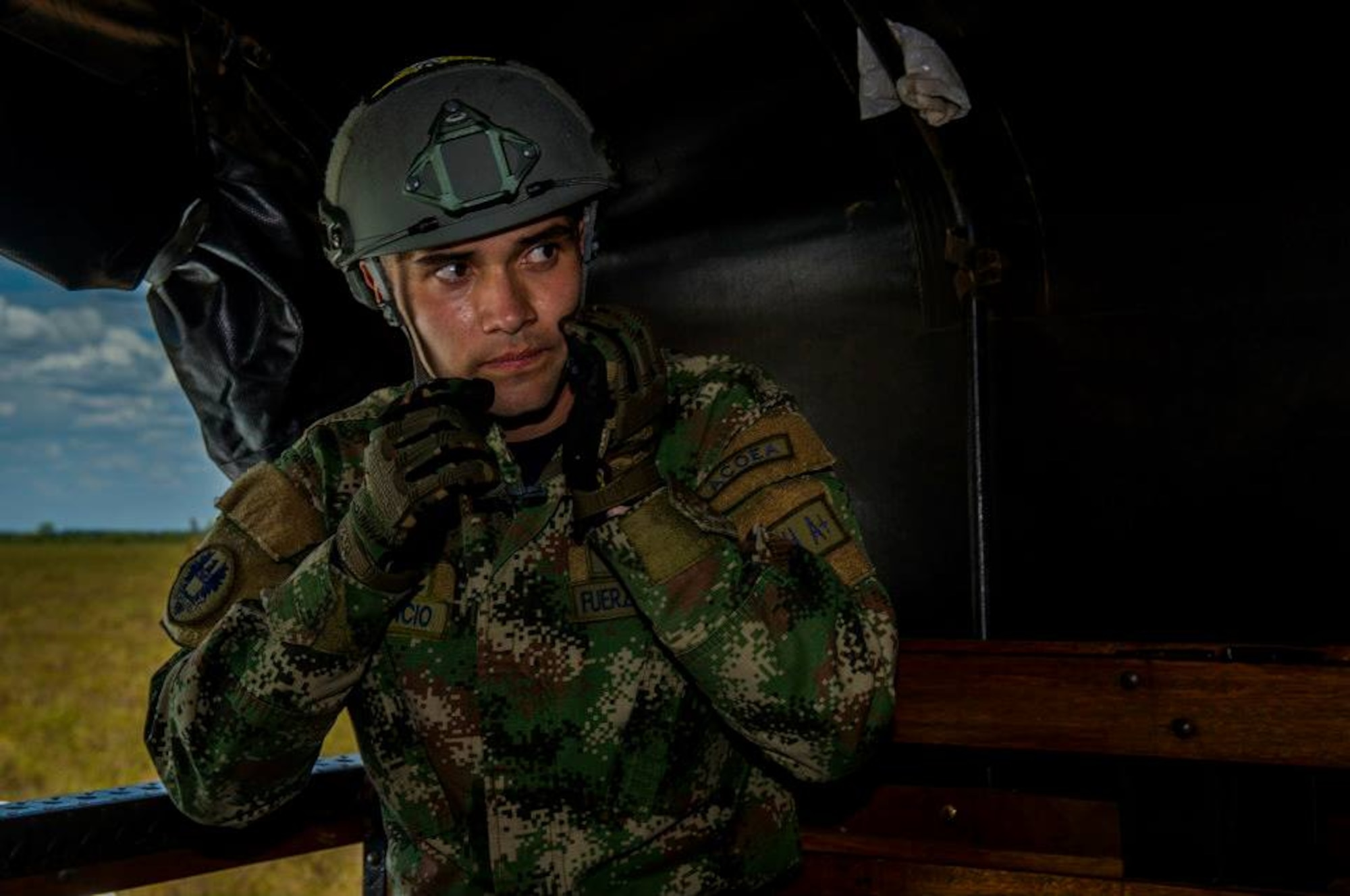 Tecnico Tercero Ramiro Roncancio, a Colombian Air Force Riggers, is recovered from a field after a parachute landing from a Colombian Air Force Casa 295 aircraft attempting to land as close to target during the first air drop with United States Air Force personnel aboard on March 3, 2015 at Marandua Air Force Base in Colombia, South America. (Photo by U.S. Air Force Tech. Sgt. Matthew Hannen)