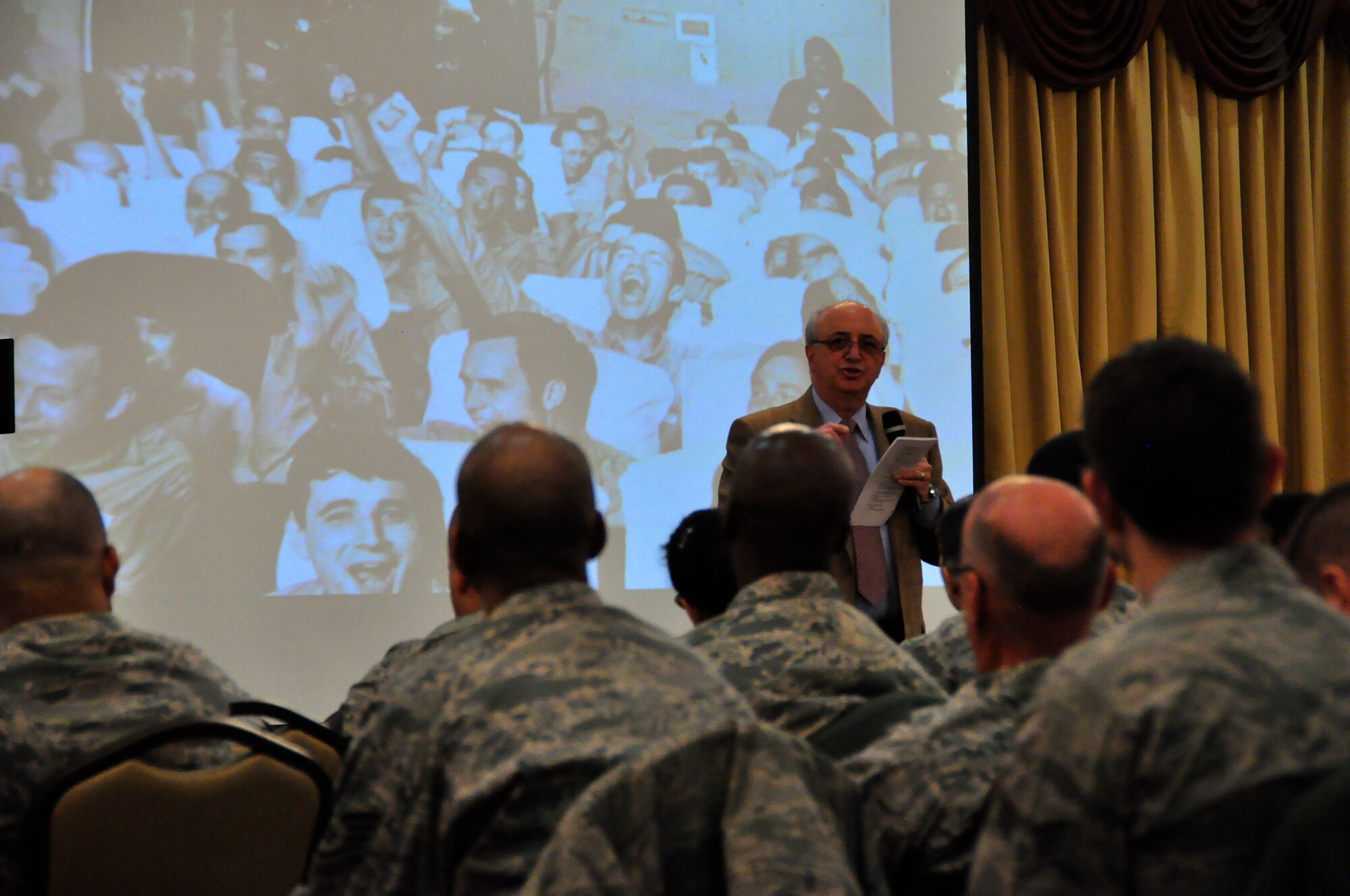 Ralph Galati, former 732d Airlift Squadron weapons systems officer and Vietnam POW talks with members of the 514th Air Mobility Wing during a commander's call March 22 (Air Force photo/Airman 1st Class Terrence Clyburn).